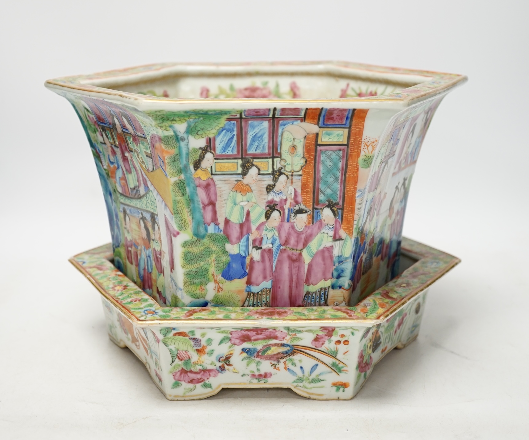 A 19th Chinese Canton decorated famille rose hexagonal planter, with stand, the stand cracked, 19.5cm total. Condition - fair